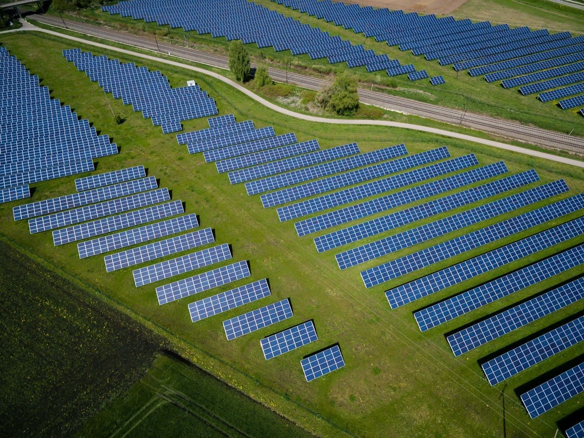 Aerial view of a large solar farm generating clean renewable energy